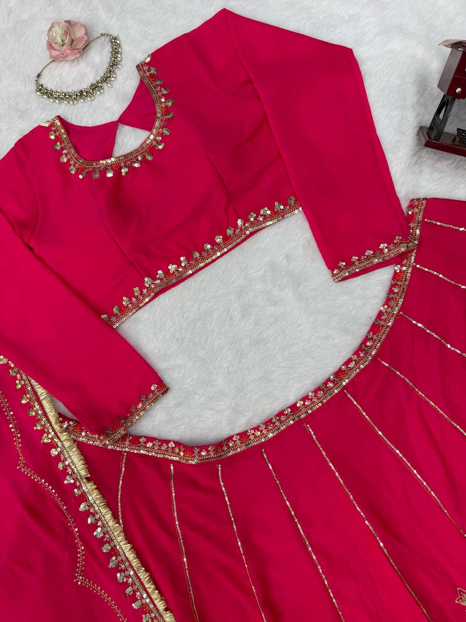 Radiant Rani Pink Silk Lehenga Choli Adorned with Opulent Heritage Floral Motifs and Intricate Zari Borders